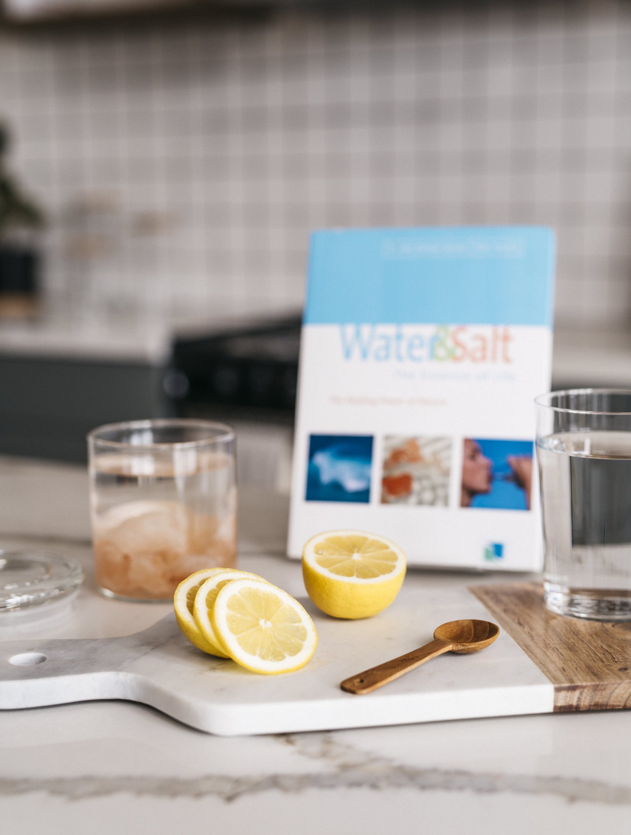 "Water & Salt: the Essence of Life" by Dr. Hendel and Peter Ferreira with Sole and lemon water right view
